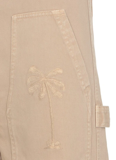 Shop Palm Angels Trousers Beige