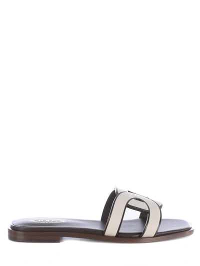 Shop Tod's Slippers In White