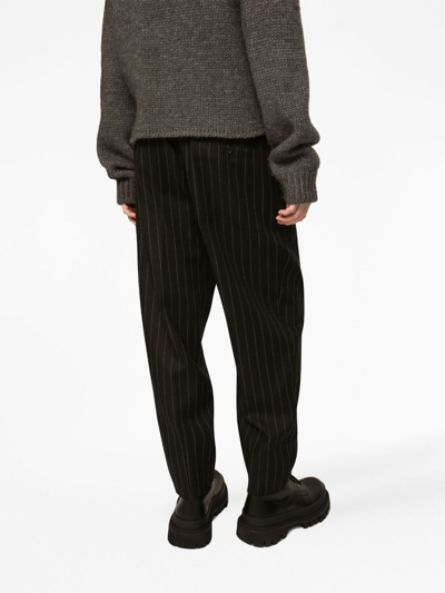 Shop Dolce & Gabbana Pinstripe Wool Tapered Trousers In Black