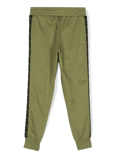 Shop Moschino Logo-print Cotton Track Pants In Green