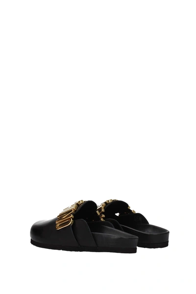 Moschino Slippers And Clogs Leather Black Gold | ModeSens