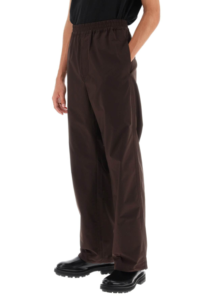 Shop Oamc 'dome' Straight Cut Pants Men In Brown
