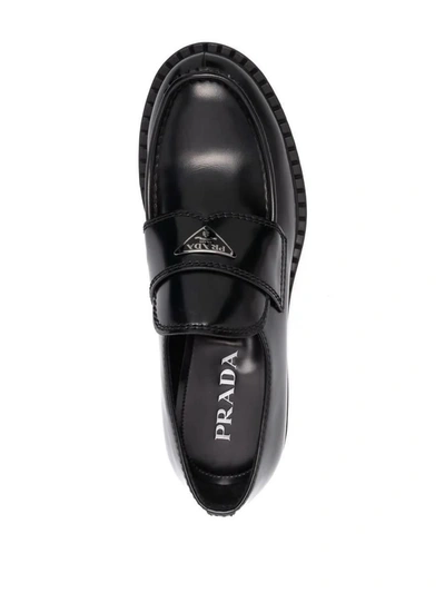 Shop Prada Logo-plaque Chunky-sole Loafers In Nero