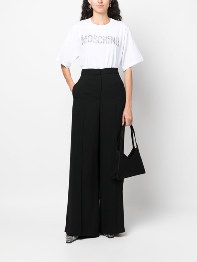 Shop Moschino High-waisted Wide-leg Trousers In Black