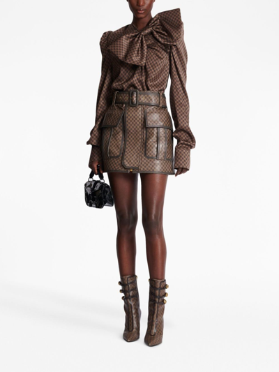 Shop Balmain Monogram-print Leather Miniskirt In Brown