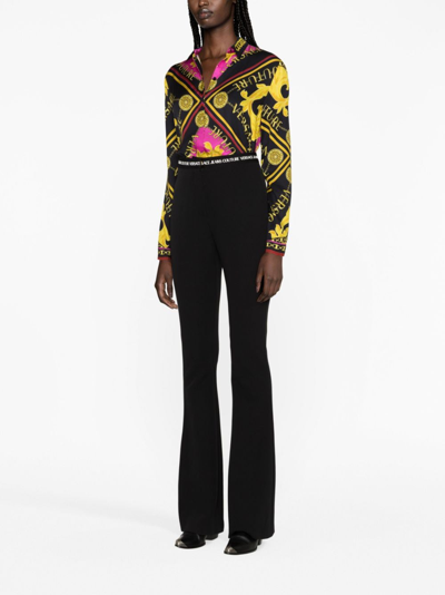 Versace Jeans Couture Logo Waistband Flared Trousers In Black