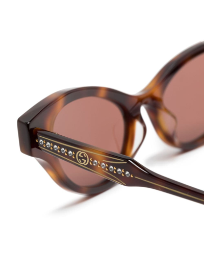 Shop Gucci Logo-engraved Cat-eye Sunglasses In Brown