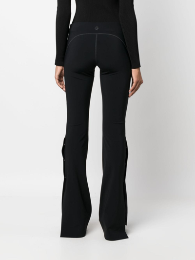 Coperni Flared High-waisted Trousers With Faux Leather Texture In Black
