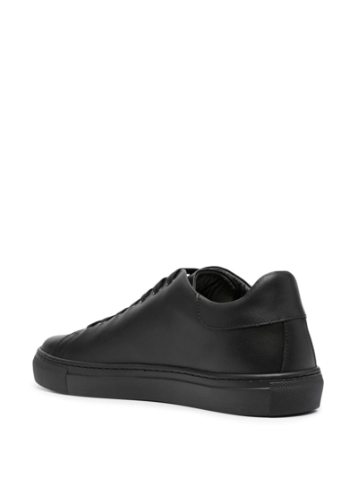 Shop Moschino Logo-embossed Leather Sneakers In Black