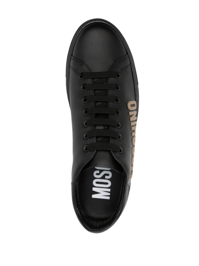 Shop Moschino Logo-embossed Leather Sneakers In Black
