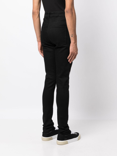 Shop Haculla Fang Lip Studded Skinny Jeans In Black