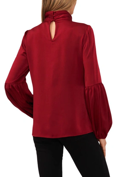 Shop Cece Mock Neck Blouson Sleeve Satin Top In Mulberry Red