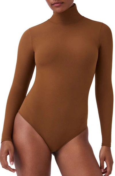 Shop Spanx Long Sleeve Smoother Thong Bodysuit In Salted Caramel
