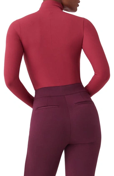 Shop Spanx Long Sleeve Smoother Thong Bodysuit In Wild Rose