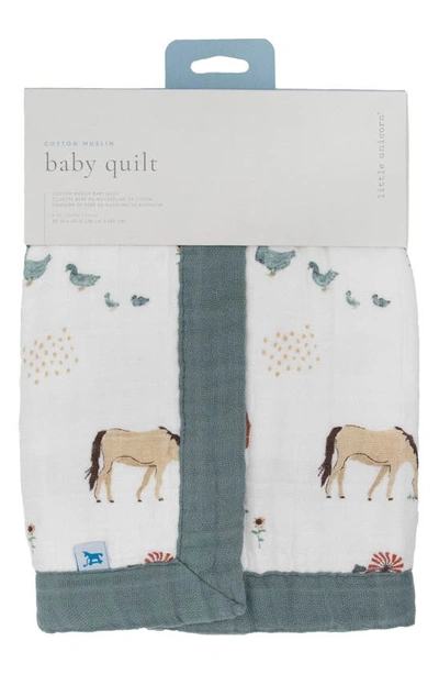 Shop Little Unicorn Cotton Muslin Baby Quilt In Farmyard