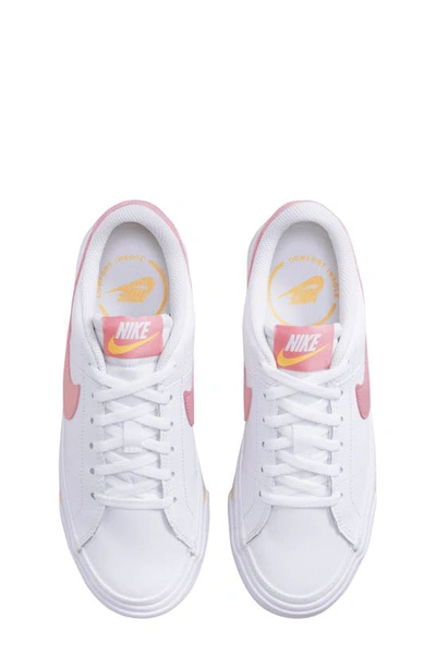 Shop Nike Kids' Court Legacy Sneaker In White/ Coral Chalk/ Orange