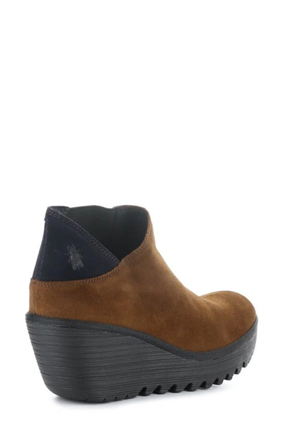 Shop Fly London Yego Wedge Bootie In 010 Camel/ Navy