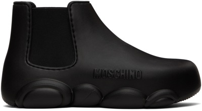 Shop Moschino Black Rubber Logo Ankle Boots In 000 Nero