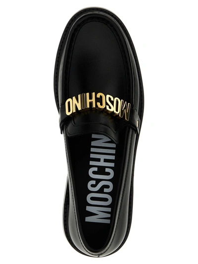 Shop Moschino Logo Loafers Flat Shoes Black