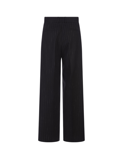 Shop Msgm Black Pinstripe Wide Leg Trousers In Nero