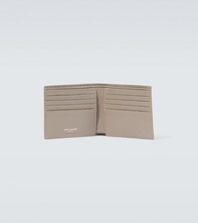 Shop Saint Laurent Tiny Cassandre East/west Bifold Wallet In Brown