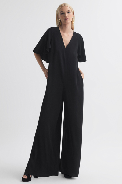 Florere Black  Relaxed Fit Cape Sleeve Jumpsuit In Black