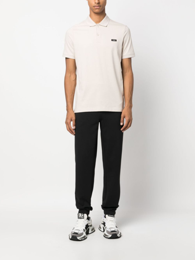 Shop Calvin Klein Logo-debossed Track Pants In Black