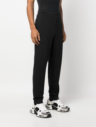 Shop Calvin Klein Logo-debossed Track Pants In Black