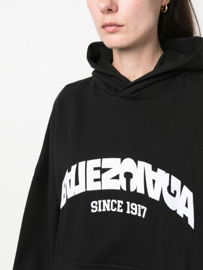 Shop Balenciaga Back Flip-print Cotton Hoodie In Black