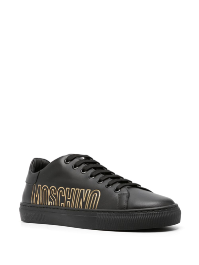 Shop Moschino Logo-debossed Leather Sneakers In 黑色
