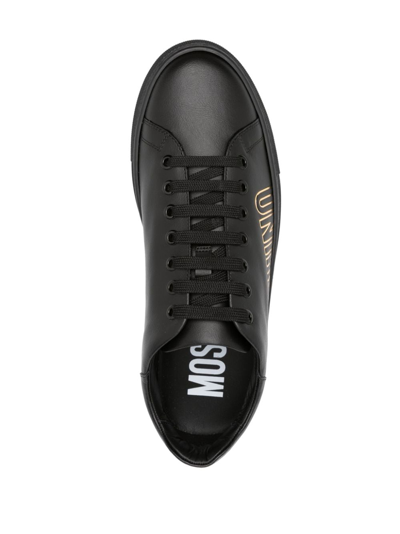Shop Moschino Logo-debossed Leather Sneakers In 黑色