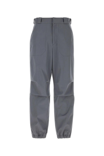 Shop Prada Rear Logo Plaque Trousers In Grey