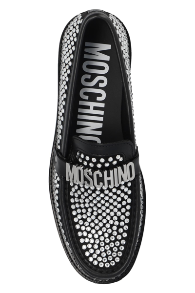 Shop Moschino Bejewelled Loafers In 00a