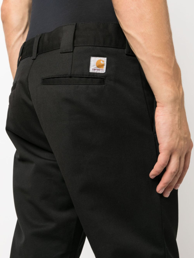 Shop Carhartt Master Logo-patch Trousers In Black