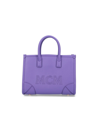 Shop Mcm Clutch In Violet
