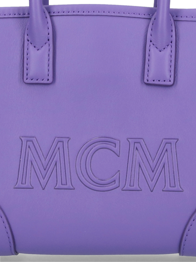 Shop Mcm Clutch In Violet