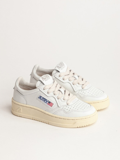 Shop Autry Low Top Sneakers In White