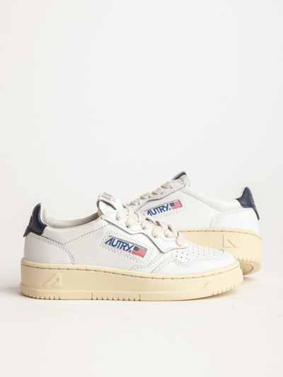 Shop Autry Low Top Sneakers In White