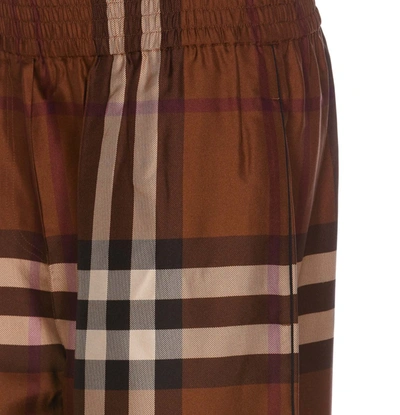 Shop Burberry Trousers In Brown