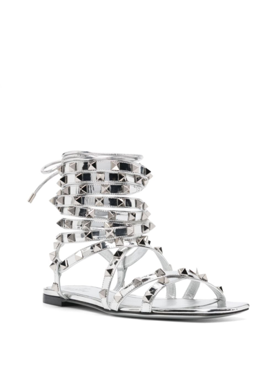 Shop Valentino Rockstud Gladiator Metallic Leather Sandals In Silver