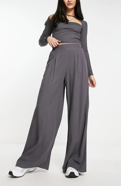 Shop Asos Design Pleated Wide Leg Trousers In Grey