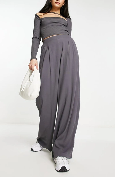 Shop Asos Design Pleated Wide Leg Trousers In Grey