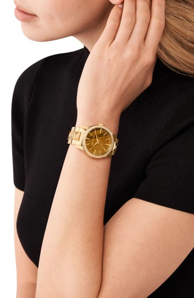 Michael Kors gold watch and Accessory Concierge bracelet, and