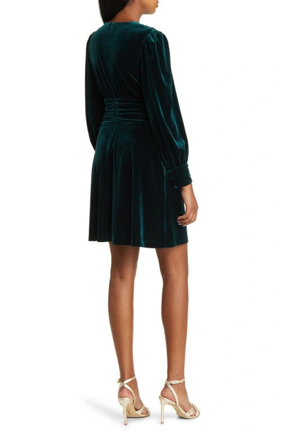 Shop Vince Camuto Twist Front Long Sleeve Velvet Fit & Flare Dress In Hunter