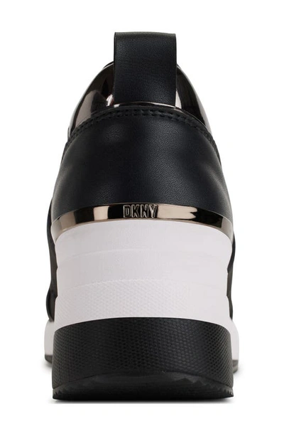 Shop Dkny Kamryn Wedge Sneaker In Black/ Dk Gunmetal