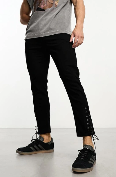 Shop Asos Design Lace-up Hem Skinny Jeans In Black