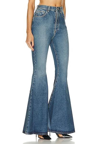 Shop Alaïa Flare Jean In Bleu Vintage