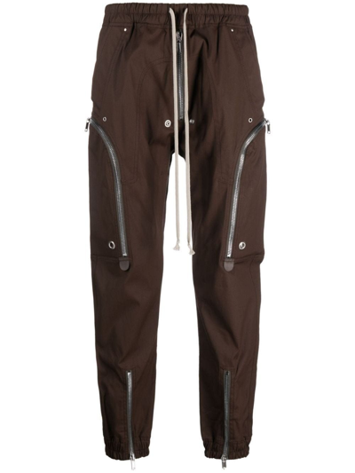 Shop Rick Owens Zip-pockets Tapered-leg Trousers In Brown