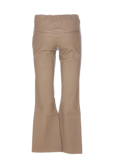 Shop Arma Trousers In Beige