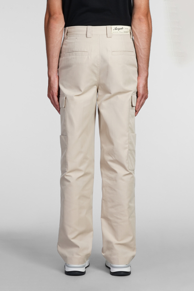 Shop Axel Arigato Pants In Beige Cotton